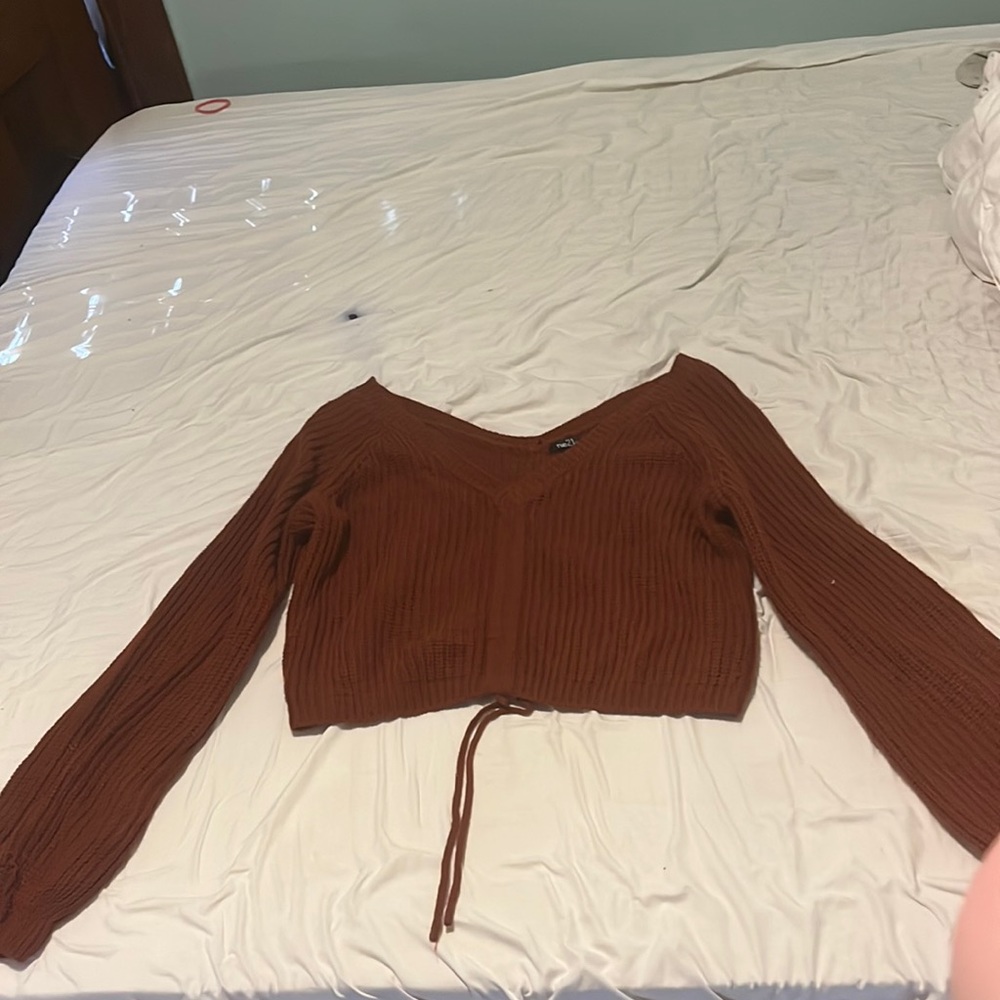 Orange/ brown crop sweater with a tie